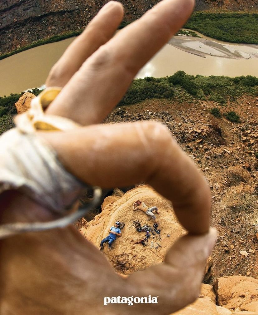 Instagram post: Hand framing tiny hiker creates scale metaphor