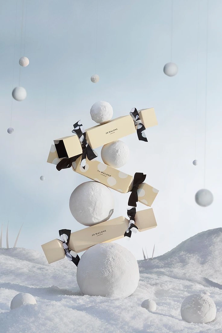 Perfume & Fragrance creative ad: Balanced stack of gift crackers and snowballs