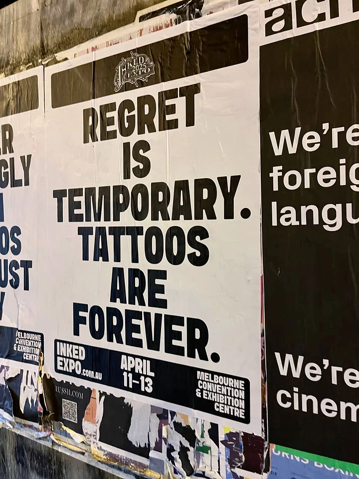 Tattoo Studios creative ad: 'Regret is temporary' flip, bold type poster