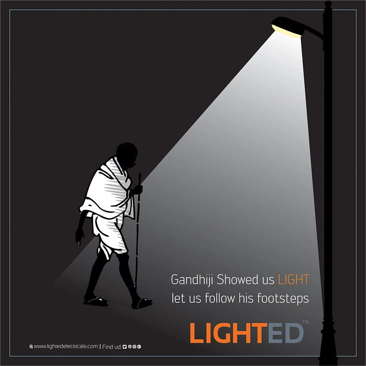 Gandhi Jayanti creative ad: Gandhi silhouette walking under a street lamp's light beam