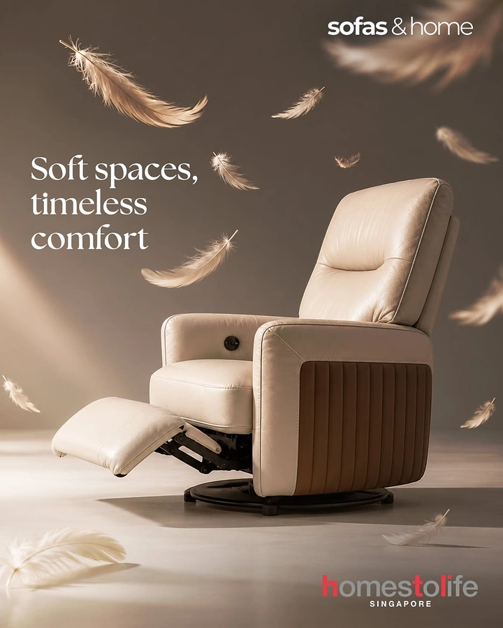 Creative ad: Cream leather swivel recliner with footrest extended amid floating feathers