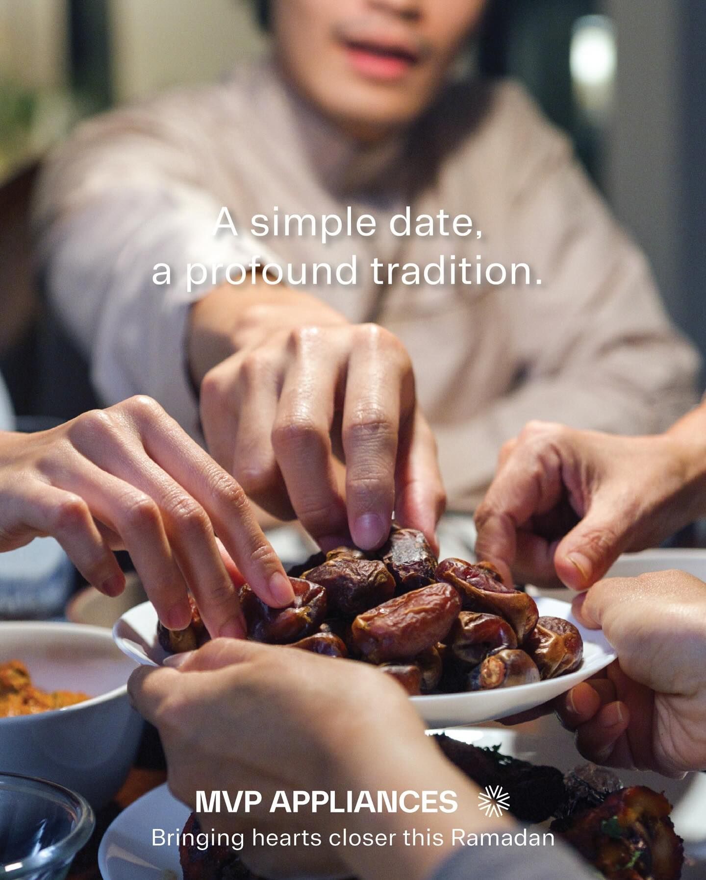 Ramadan Instagram post: Several hands reaching into a shared plate of dates at iftar