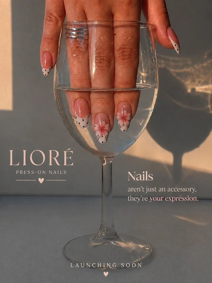 Nail Salons creative ad: Hand in wine glass, moody unexpected composition