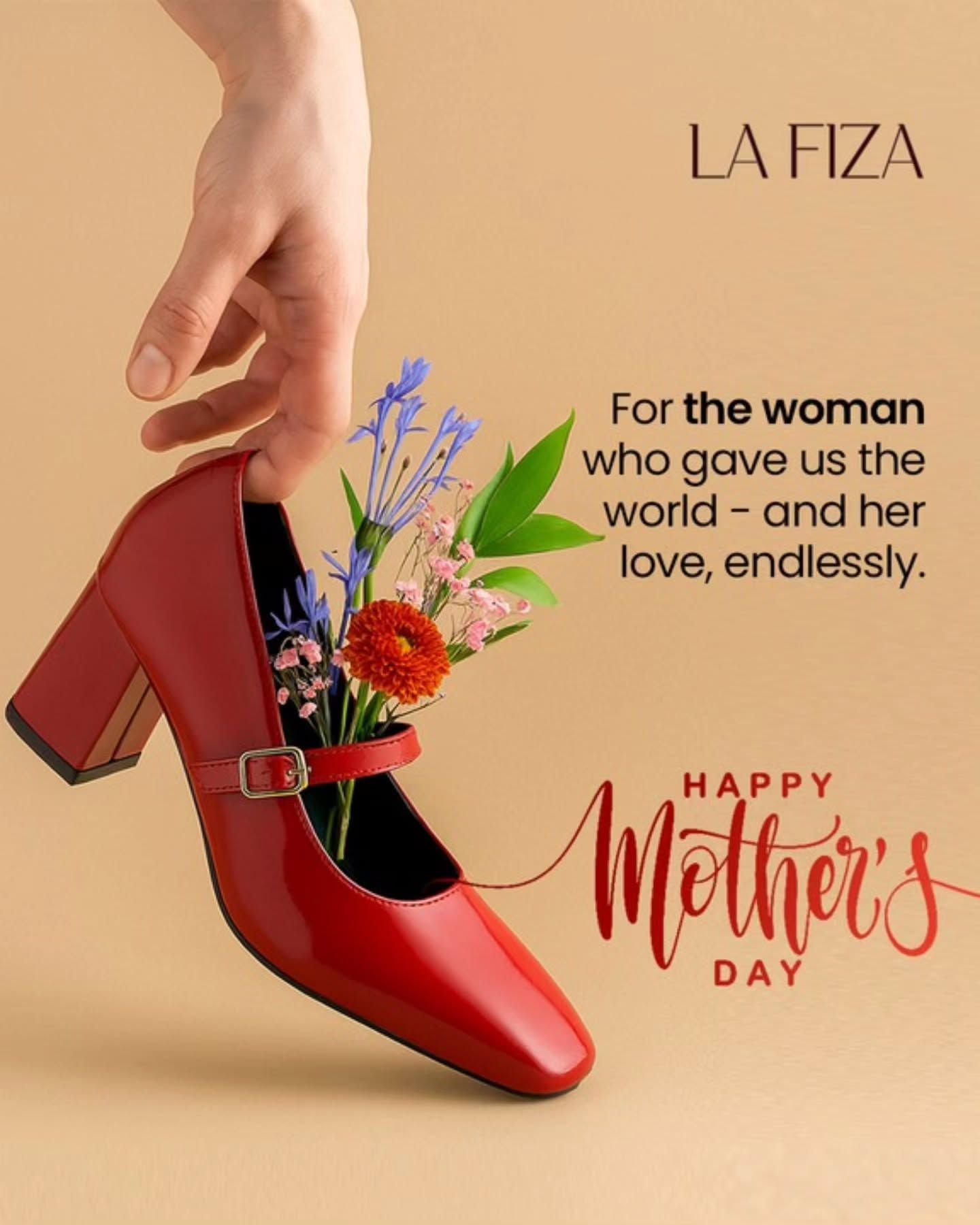A hand holding a red Mary Jane heel filled with fresh flowers