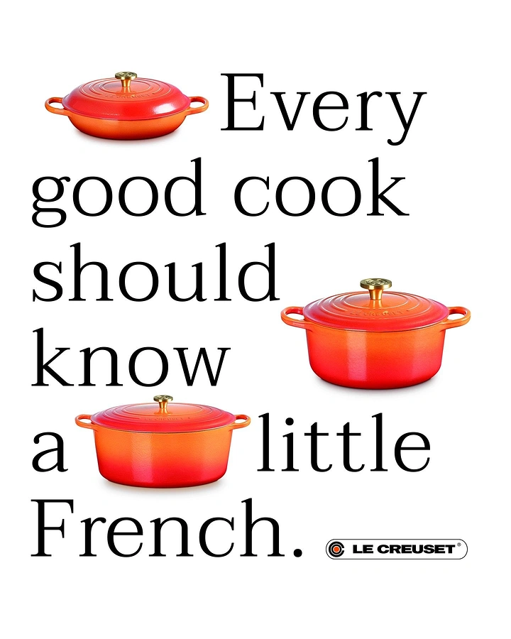 Kitchenware & Cookware creative ad: Three flame-orange enamel cast-iron pots set into a type layout