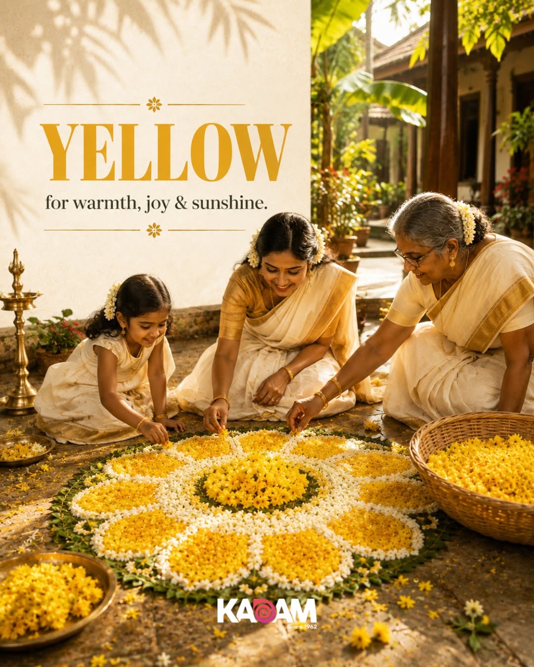 Flower pookalam beside a brass lamp and folded gold-bordered kasavu cloth