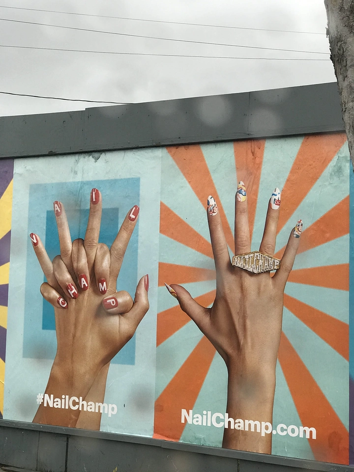 Nail Salons creative ad: Retro sunburst mural of posed hands