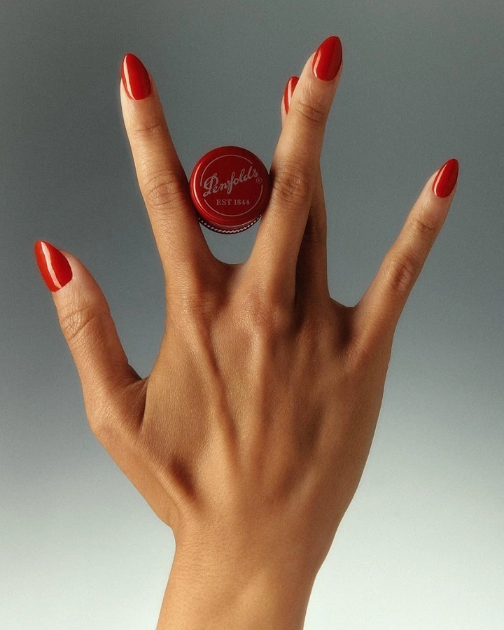 Nail Polish Brands creative ad: Hand theatrically presents floating polish