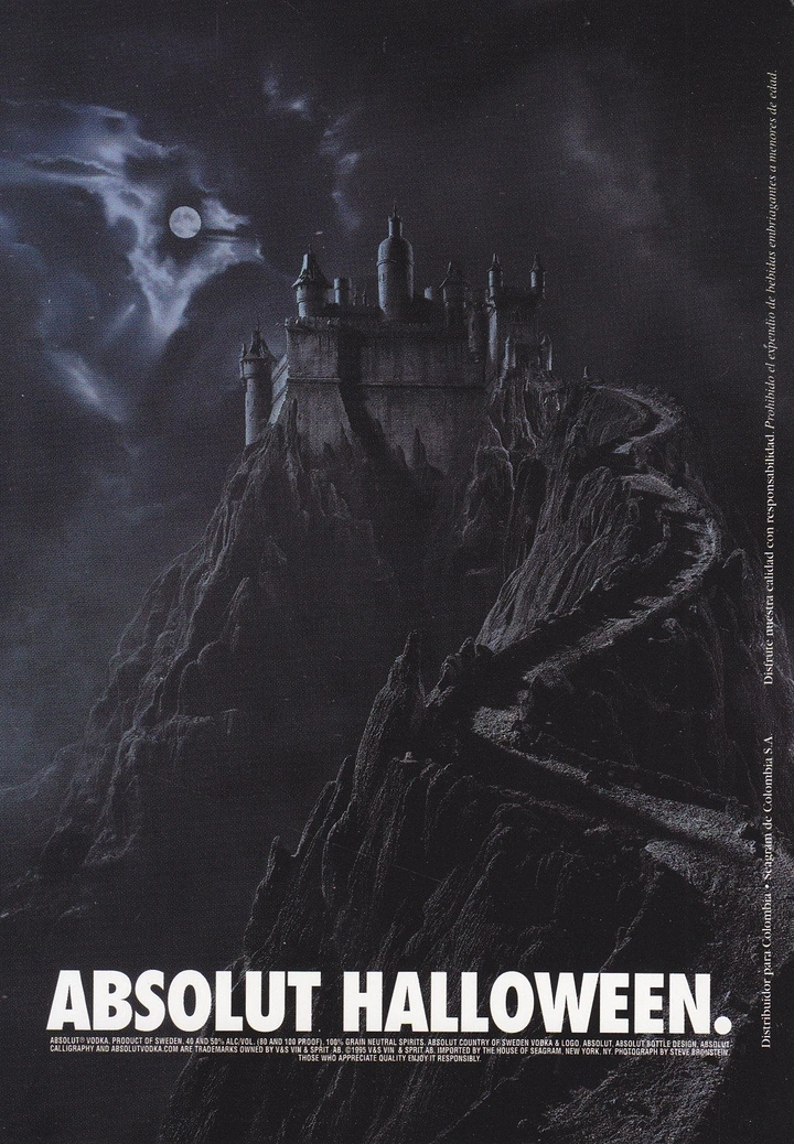 Halloween creative ad: Gothic castle atop a jagged moonlit mountain with a winding road