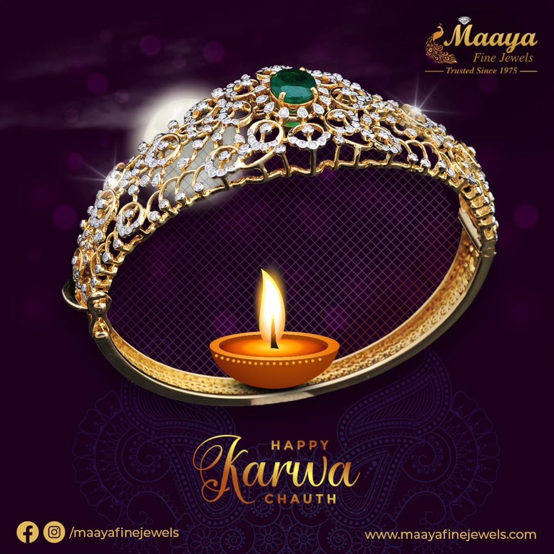 Diamond-and-emerald gold bangle as a sieve with a diya inside