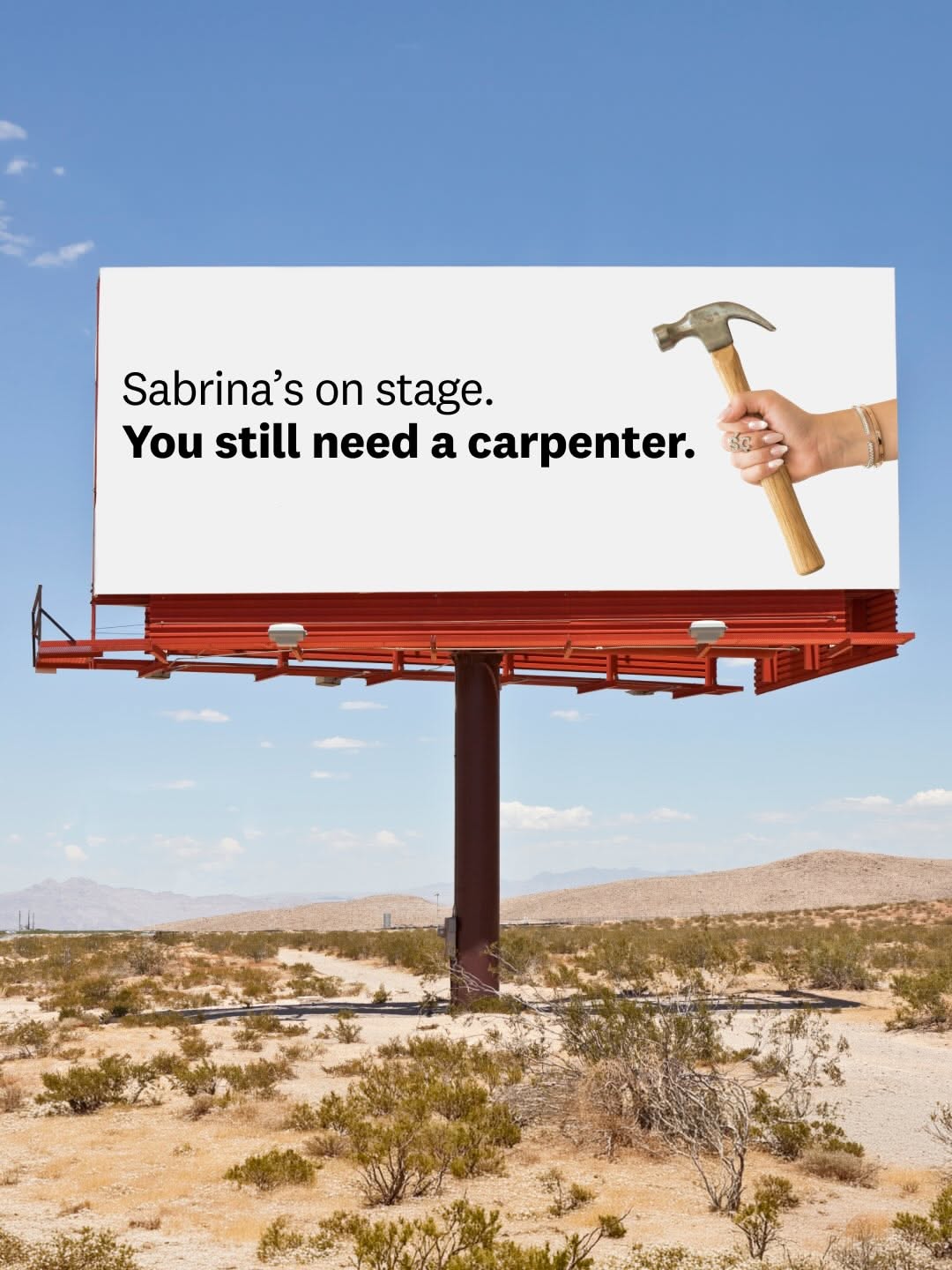 Carousel: Desert billboard with a manicured hand holding a hammer, slide 1