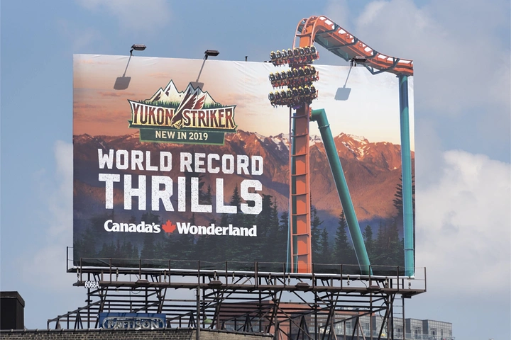 Amusement & Water Parks creative ad: Coaster track bursts out of billboard