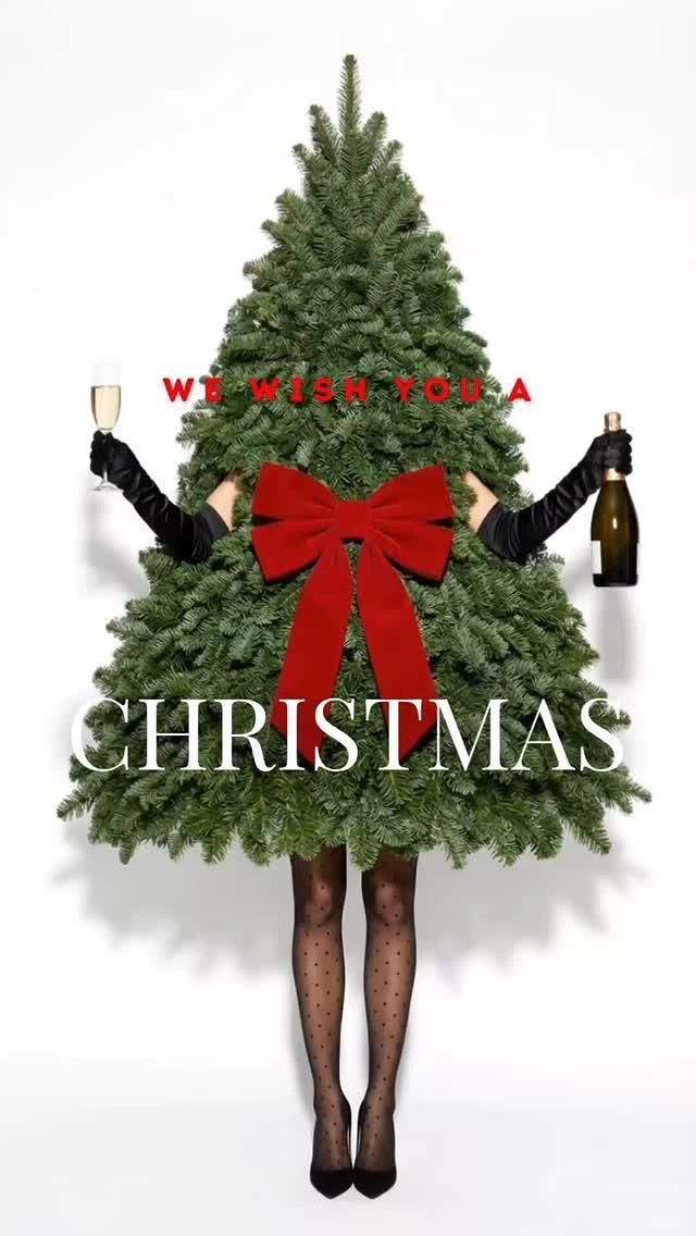 Christmas creative ad: Woman dressed as a Christmas tree holding champagne