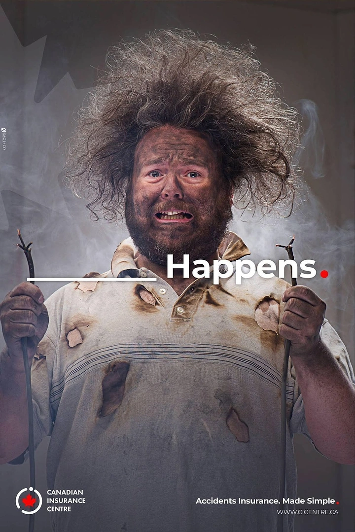 Insurance creative ad: Soot-covered electrocuted man holding cut cables