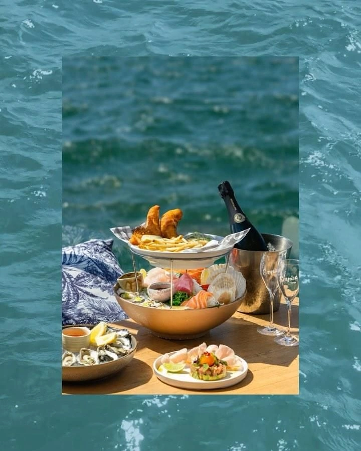 Seafood Restaurants creative ad: Seafood picnic staged improbably at sea