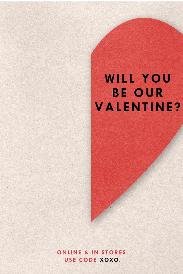 Valentine's Day creative ad: Red paper half-heart cut off by the right edge