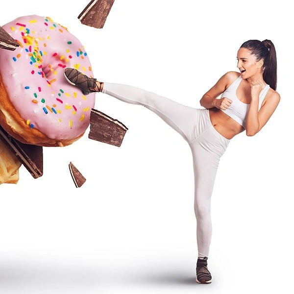 Weight Loss Clinics creative ad: Memorable kicking-food temptation visual