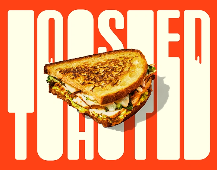 Restaurant & Cafe creative ad: Toasted sourdough chicken avocado sandwich over giant type