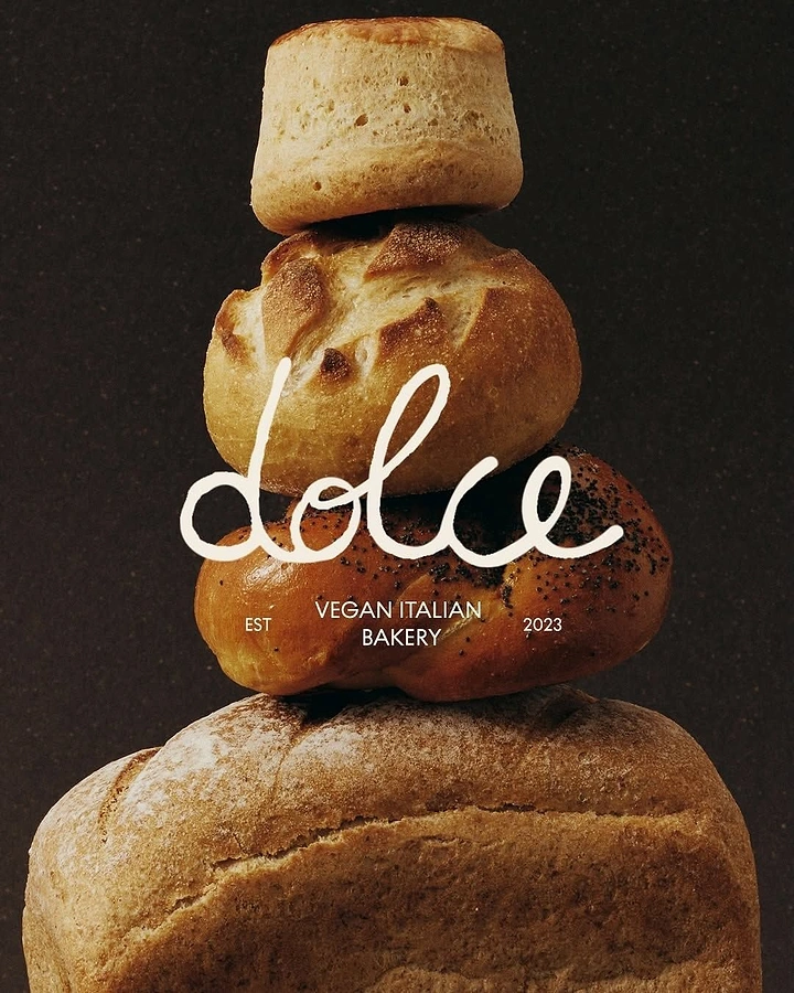 Creative ad: Tower of stacked breads and buns against a dark brown backdrop