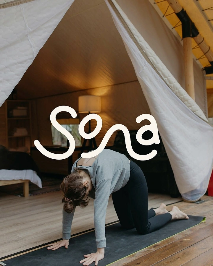 Yoga Studios creative ad: Flowing wordmark echoes spine in cat pose