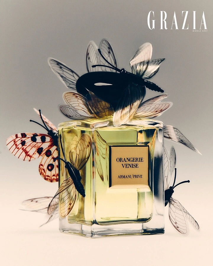 Media creative ad: Square perfume bottle covered in translucent butterflies and winged insects