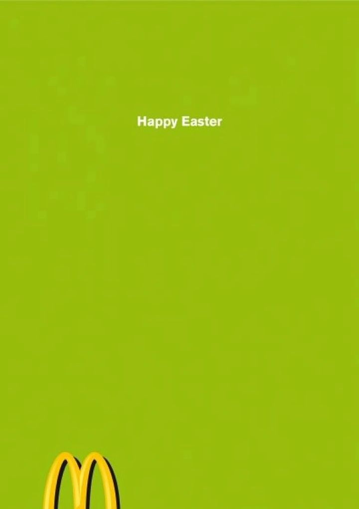 Easter creative ad: Golden arches logo peeking up from the bottom edge like bunny ears in grass