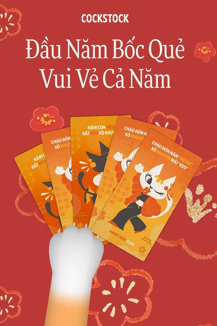 Lunar New Year creative ad: Cat paw holding a fan of orange fortune cards