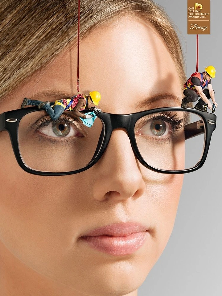 Opticians & Eye Care creative ad: Miniature workers cleaning giant eyeglasses
