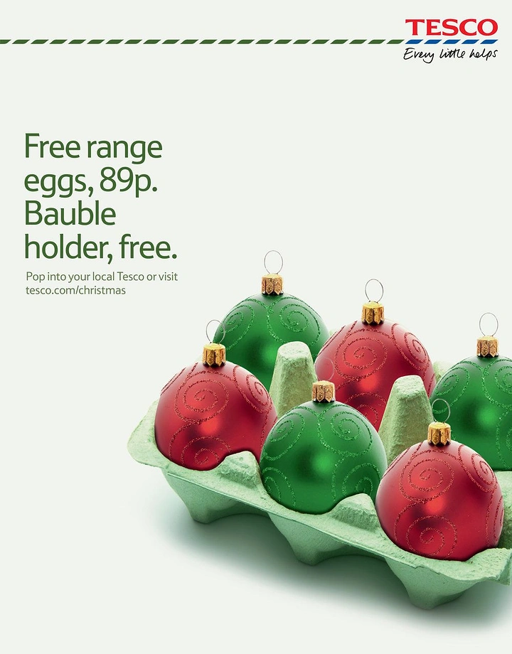 Christmas creative ad: Red and green Christmas baubles sitting in a pulp egg carton
