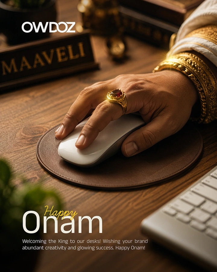 Onam creative ad: King Maveli's jewelled hand using a computer mouse on an office desk