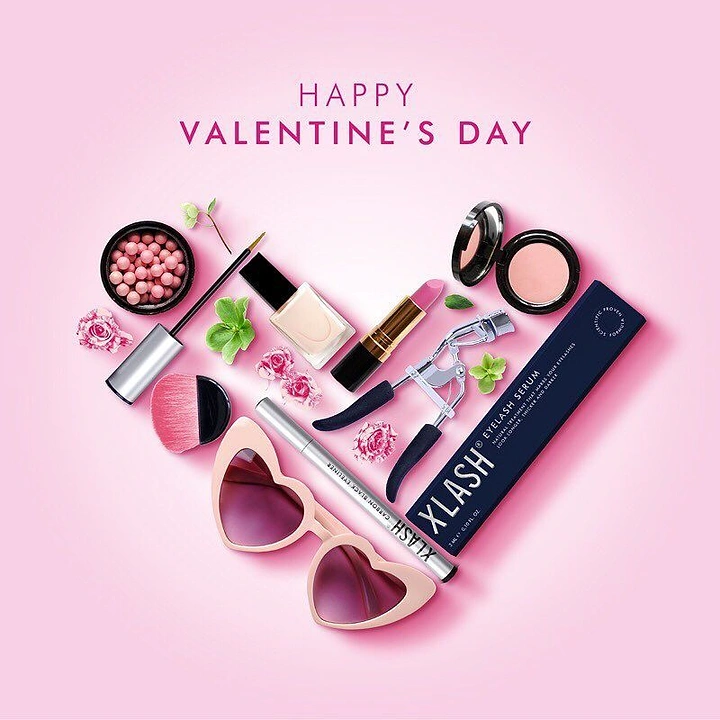 Valentine's Day creative ad: Makeup products arranged in a heart shape