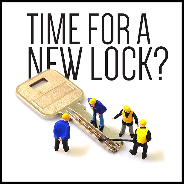 Locksmiths creative ad: Miniature workers servicing giant key
