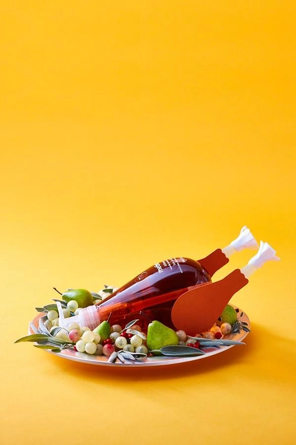 Thanksgiving creative ad: Liquor bottle styled as a roast turkey on a platter