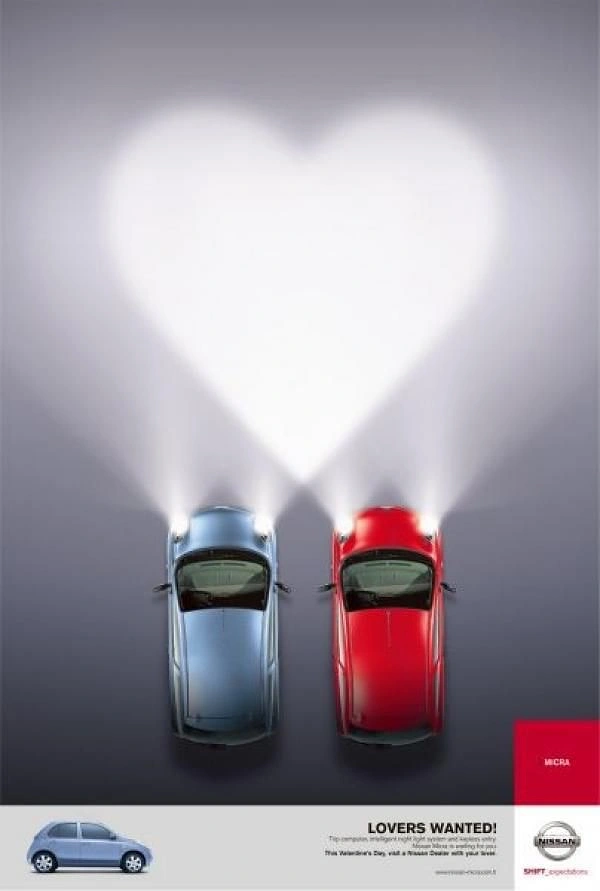 Valentine's Day creative ad: Two cars seen from above whose headlight beams merge into a heart