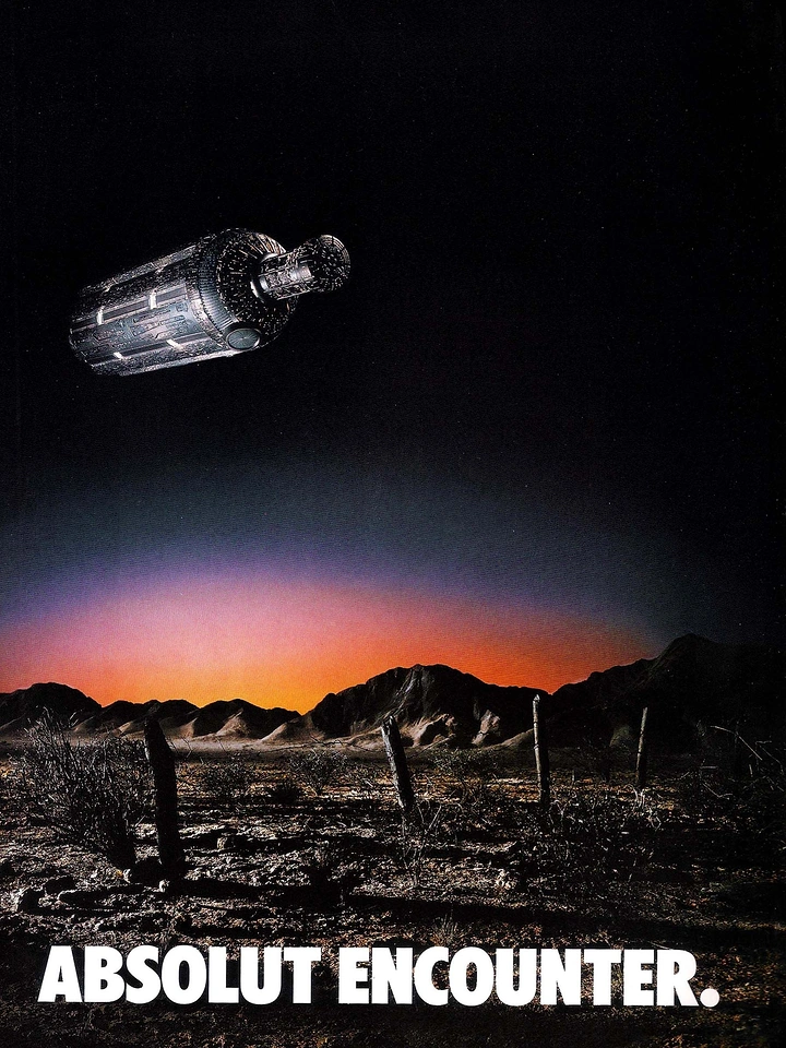 Creative ad: Bottle-shaped UFO hovering over a desert at dusk