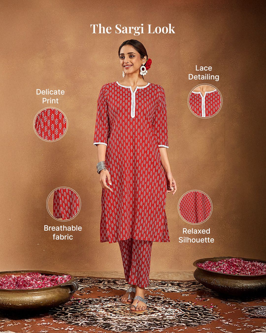 Three women in embroidered red and wine ethnic wear, one holding a sieve and thali