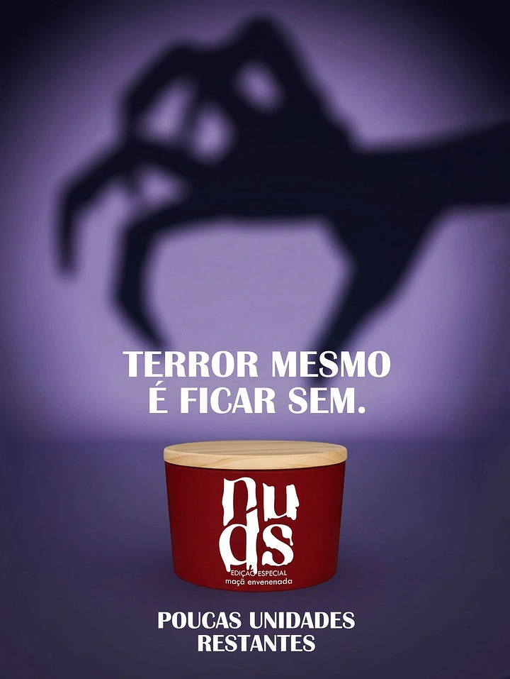 Halloween creative ad: Red jar with wooden lid under a creeping claw-hand shadow