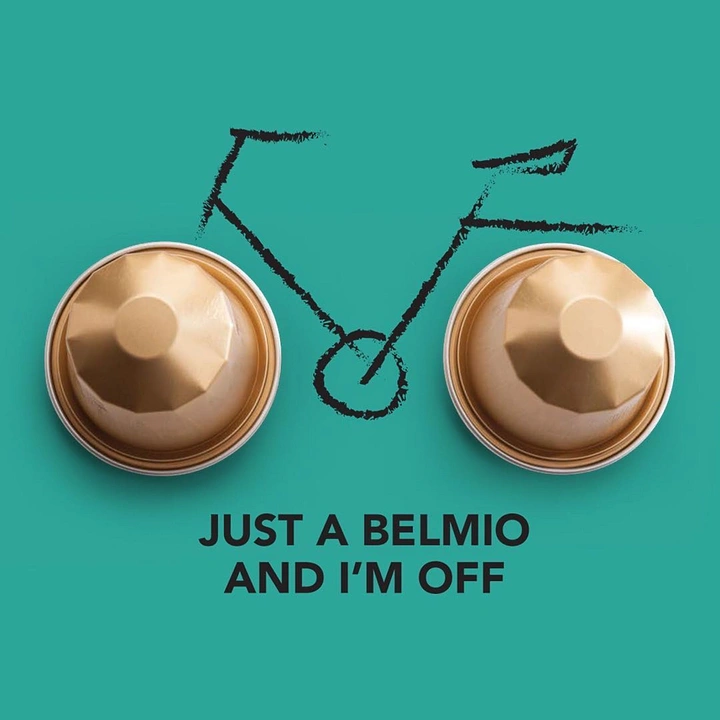 Soft Drinks & Beverages creative ad: Two gold coffee capsules as bicycle wheels with a sketched frame