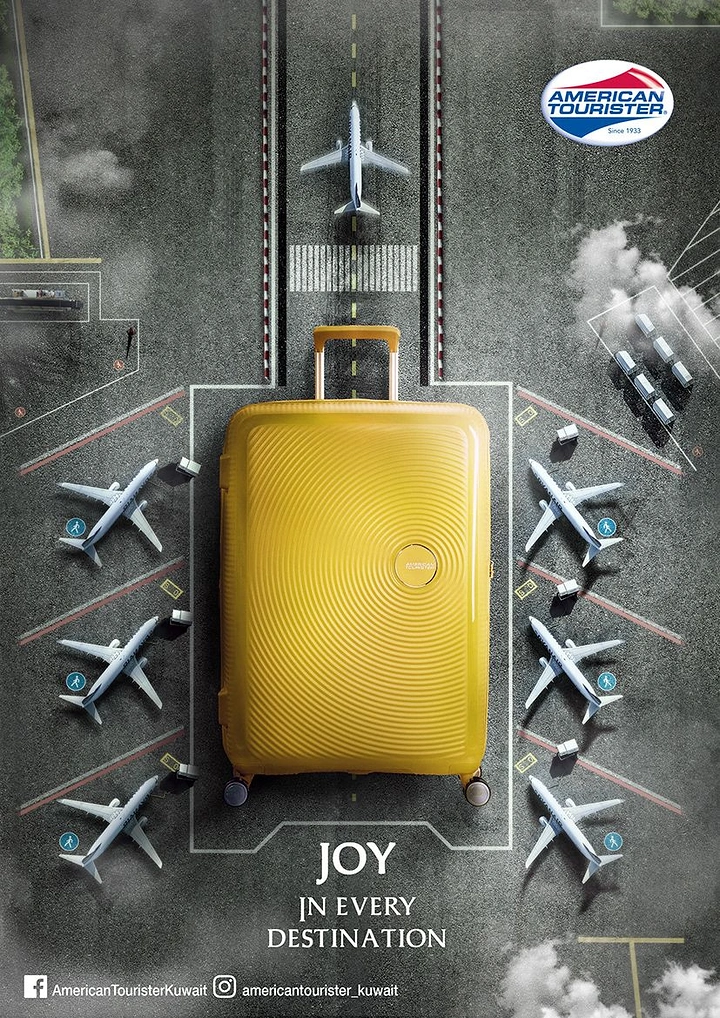 Creative ad: Giant yellow hard-shell suitcase parked like a plane at an airport gate, top-down view