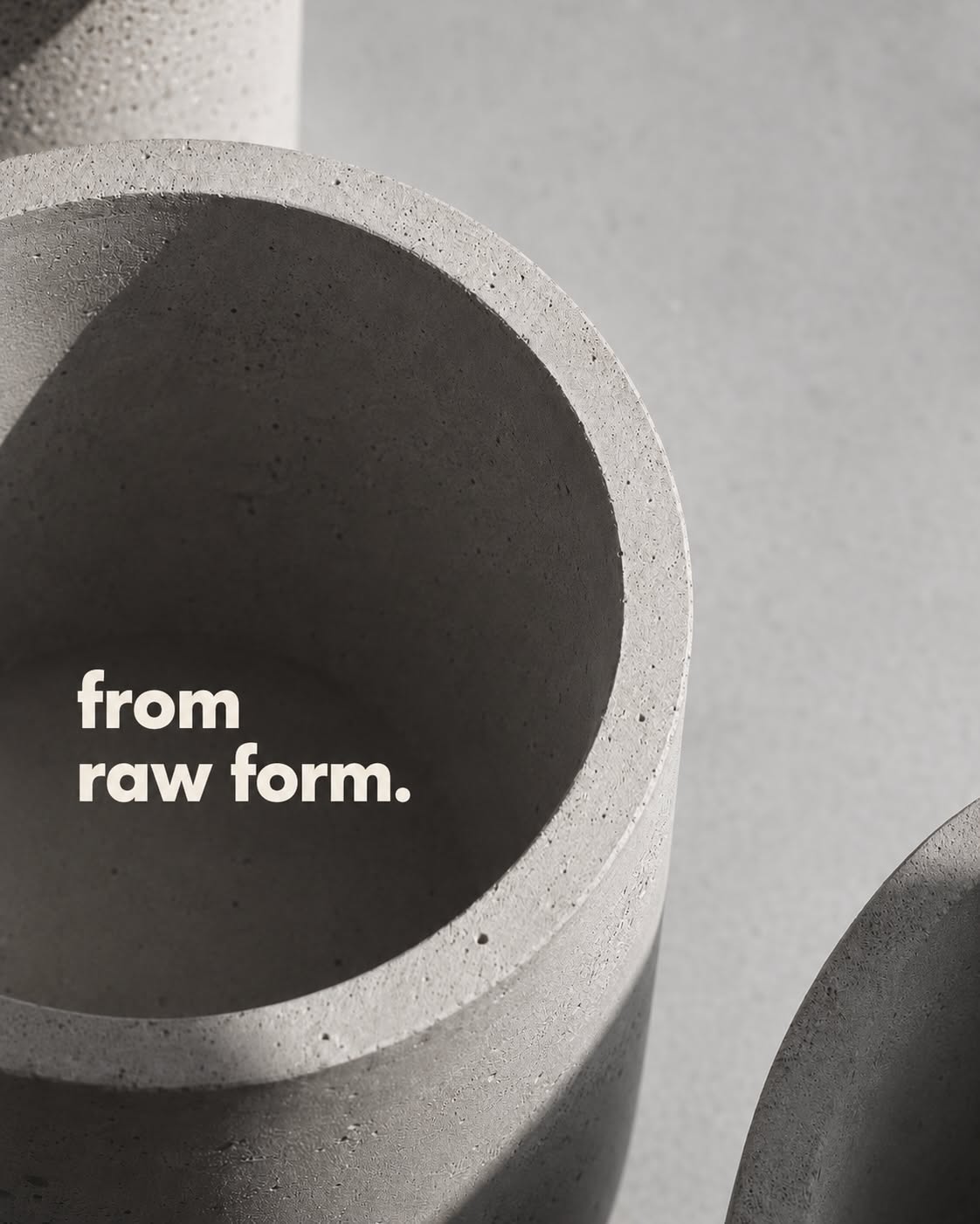 Carousel: Close-up of cylindrical concrete planter rims, slide 1