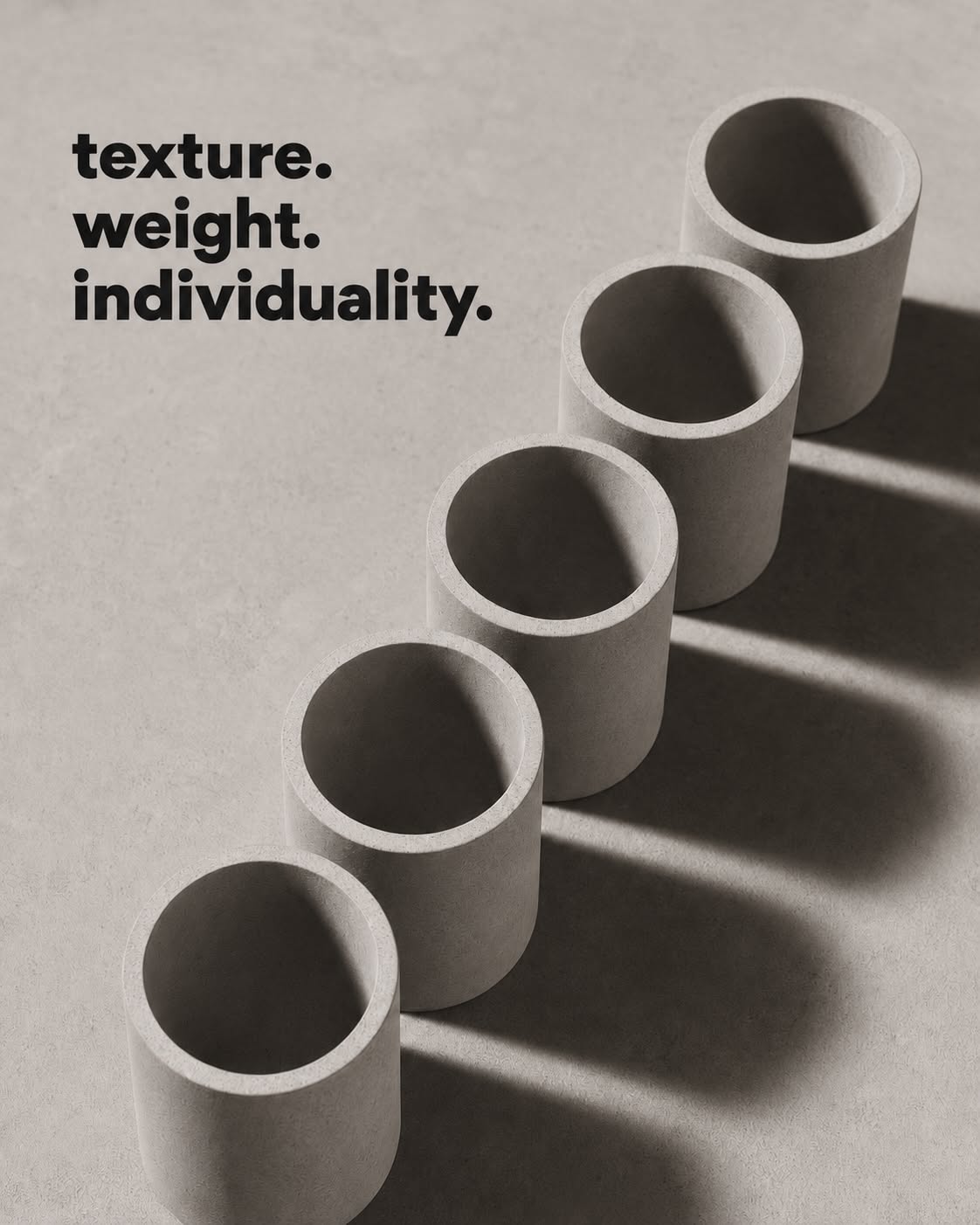 Carousel: Close-up of cylindrical concrete planter rims, slide 2