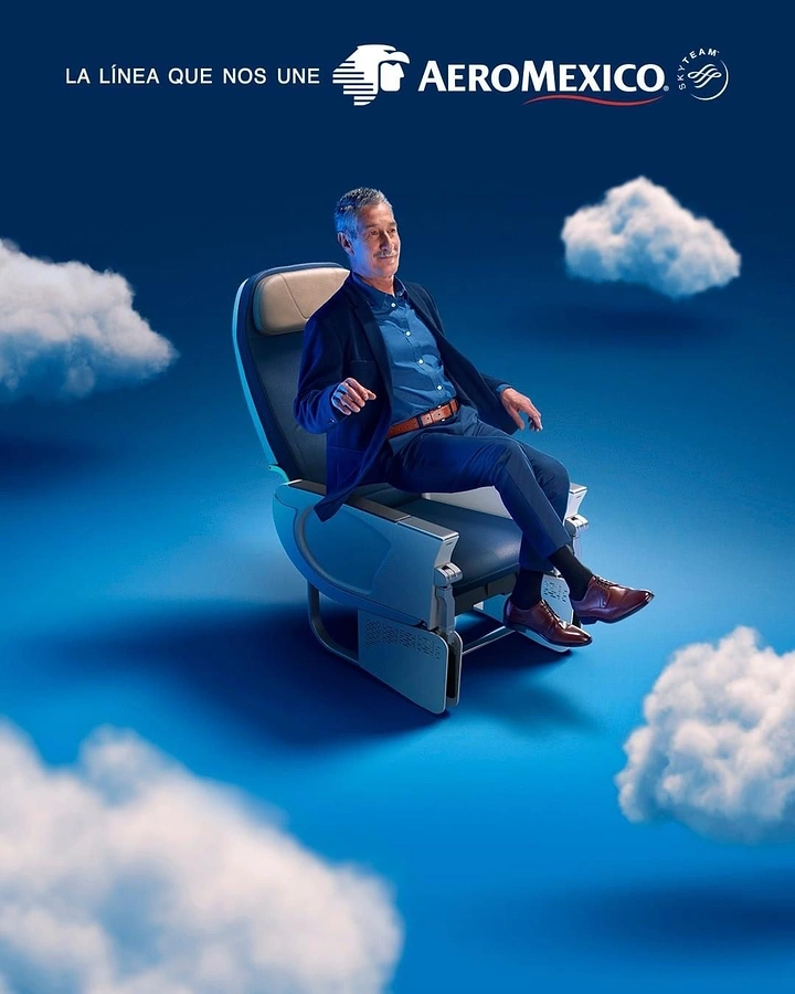 Creative ad: Smiling man relaxing in an airline seat floating among clouds