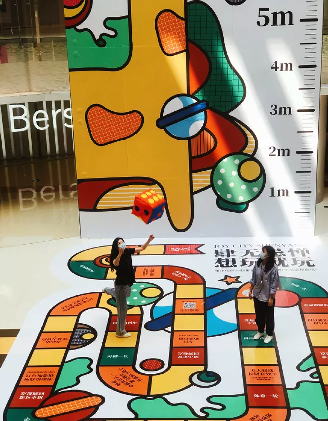 Instagram post: Oversized walk-on board game installation