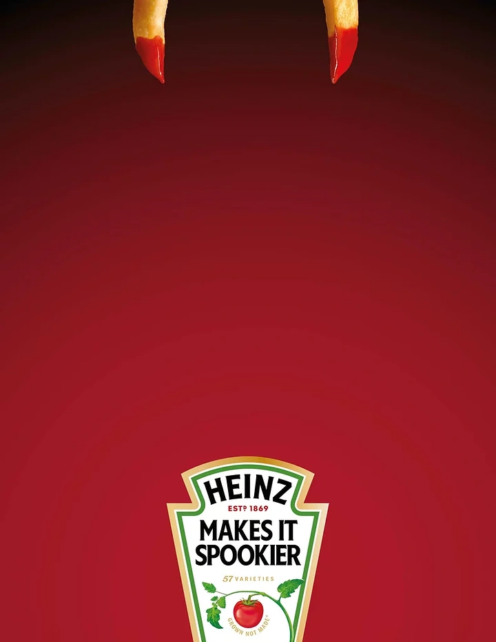 Halloween creative ad: Two ketchup-tipped fries hanging like vampire fangs