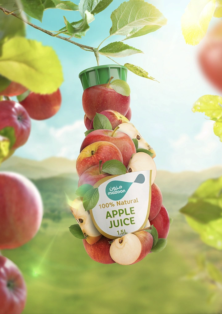 Creative ad: Bottle shape built from stacked apples hanging from a branch