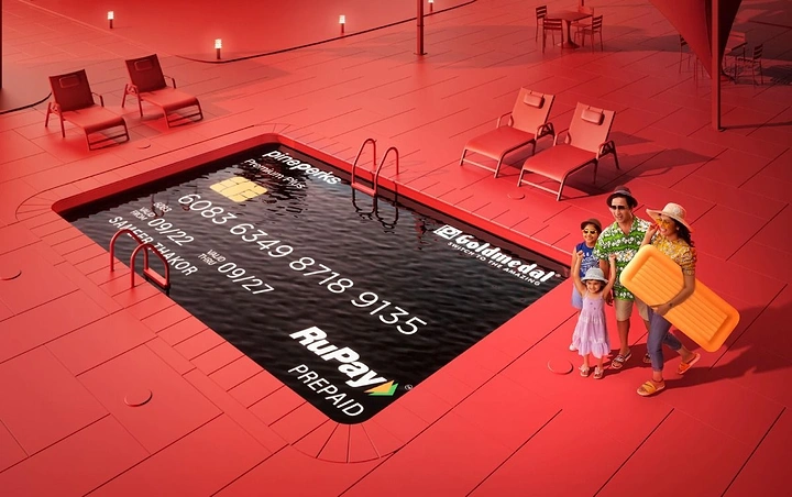 Finance & Banking creative ad: Swimming pool shaped like a prepaid card, with a family beside it