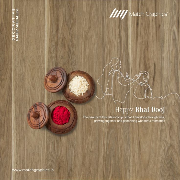 Carved wooden bowls of rice and kumkum on a wood-laminate surface