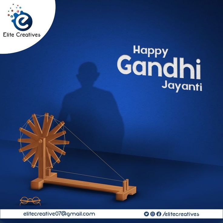 Wooden charkha casting Gandhi's shadow
