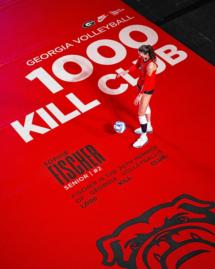 Education creative ad: Overhead shot of volleyball player standing on red court painted with giant milestone text