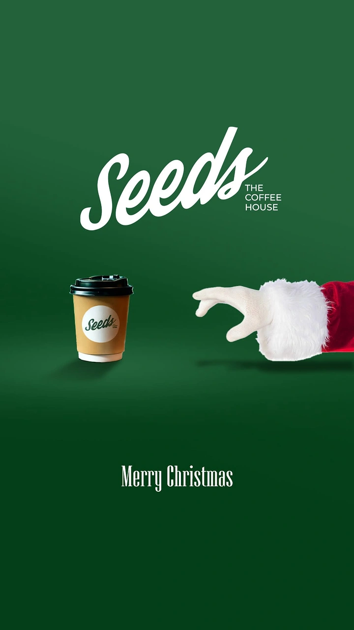 Christmas creative ad: Santa's gloved hand reaching for a takeaway coffee cup